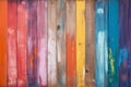 Wooden plank wall painted with different colourful paints