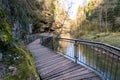 Wooden planks as a path with metal railings in the ravine Schwarzachklamm