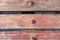 Wooden planks of red color from the bench close up Royalty Free Stock Photo