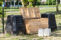 Wooden and plastic compost boxes Royalty Free Stock Photo