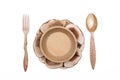 Wooden plate bowl with spoon and fork. Royalty Free Stock Photo