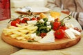 Wooden plate with cheese