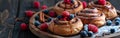 Wooden Plate With Croissants Covered in Berries Royalty Free Stock Photo