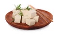 Wooden plate with delicious tofu, rosemary and chopsticks isolated on white Royalty Free Stock Photo