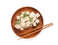 Wooden plate with delicious tofu, rosemary and chopsticks isolated on white, top view Royalty Free Stock Photo