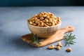 wooden plate filled with cashew nuts Royalty Free Stock Photo