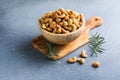 wooden plate filled with cashew nuts Royalty Free Stock Photo