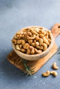 wooden plate filled with cashew nuts Royalty Free Stock Photo