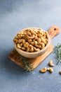 wooden plate filled with cashew nuts Royalty Free Stock Photo