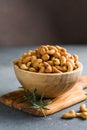 wooden plate filled with cashew nuts Royalty Free Stock Photo