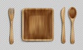 Wooden plate, fork, spoon and knife top view. Royalty Free Stock Photo