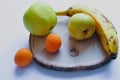 fruit mix on a wooden plate Royalty Free Stock Photo