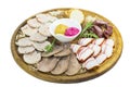 Wooden plate with several types of sausage and bacon Royalty Free Stock Photo