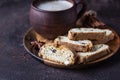 Wooden plate with traditional Italian cookies and a cup of coffee. Biscotti or cantucci with almond and raisin. Brown stone Royalty Free Stock Photo