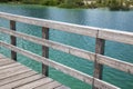 Wooden platform and fence on the river bank