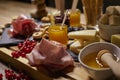 Platter of cold cuts and cheeses with spicy mustard jams and snacks Royalty Free Stock Photo