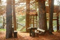 Wooden playground in park or woodland on sunny autumn day. Ecological equipments for kids playgrounds Royalty Free Stock Photo