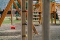 Wooden playground with swings, slides and climbing walls