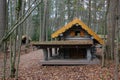 Wooden playhouse for kids. Log house on a playground. Carved wood house for kids` leisure activity Royalty Free Stock Photo