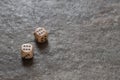 Wooden playing dice on stone background, luck and win concept