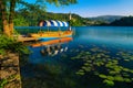 Wooden Pletna boat moored at the pier, lake Bled, Slovenia