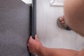 Wooden plinth in the room, installation of the plinth by a master carpenter. Royalty Free Stock Photo