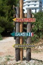 Wooden pointing arrows in the street in Ksamil, Albania