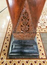 wooden pole with a unique pattern, serves as the main pillar supporting the house