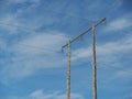 Wooden pole with wire for electricity against blue cloudy sky, copy space. Industry concept Royalty Free Stock Photo