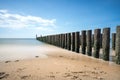 Wooden poles in the sea Royalty Free Stock Photo