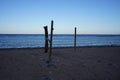 Wooden poles on the shores of the Red Sea in the Gulf of Aqaba. Dahab, South Sinai Governorate, Egypt Royalty Free Stock Photo