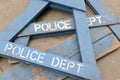 Wooden police barrier with white stenciled lettering