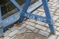 Wooden police barrier with white stenciled lettering Royalty Free Stock Photo