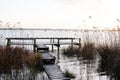 Wooden ponton jetty for fishing boat in wild lake coast in hourtin port France Royalty Free Stock Photo