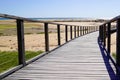 Wooden pontoon sea access walkway on sandy beach atlantic ocean horizon in Jard sur Mer in france Royalty Free Stock Photo