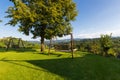 Wooden porch swing in garden with view of vineyard in Austria Royalty Free Stock Photo