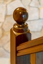 Wooden post on the bannister of a stairwell Royalty Free Stock Photo