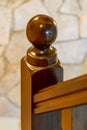 Wooden post on the bannister of a stairwell Royalty Free Stock Photo