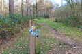 Wooden post with different hiking and mountain bike routes Royalty Free Stock Photo