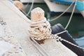 Wooden post with mooring ropes for tying boats and ships Royalty Free Stock Photo
