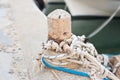 Wooden post with mooring ropes for tying boats and ships Royalty Free Stock Photo