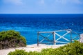 Blue Ocean Background landscape with gated off fence froeground