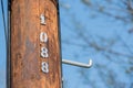 Wooden power line post numbered Royalty Free Stock Photo