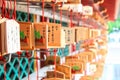 Wooden prayer boards, ema, hang at a Japanese shrine