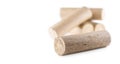 Wooden pressed briquettes from biomass on a white isolated backg Royalty Free Stock Photo