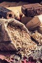 Wooden pressed pellets and briquettes from biomass. Royalty Free Stock Photo