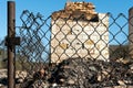 A wooden private house destroyed after a fire. The consequences of a forest fire in the village. Charred walls of a timber house Royalty Free Stock Photo