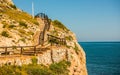 Wooden promenade along the sea coast situated on a cliff rock in Royalty Free Stock Photo