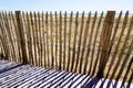 Wooden protective barrier of the dune leading to the beach sea access walkway on atlantic ocean horizon in Jard sur Mer in france Royalty Free Stock Photo