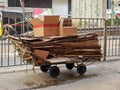 Wooden Pull Type Platform Trolley full of waste papers for recycling in Hong Kong